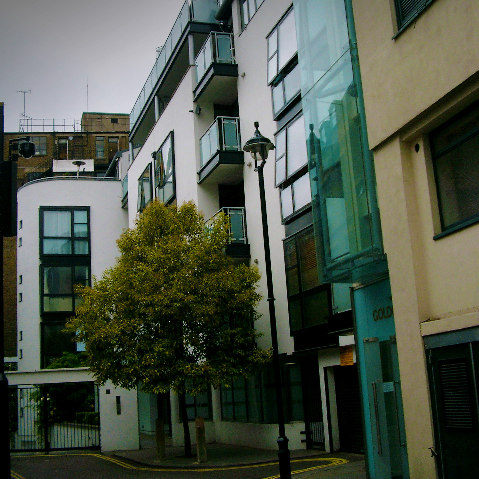 Herbert Rockcliffe's Bouchier Street, 4 storey + penthouse flats. It is a cul-de-sac with a pedestrian walk-way to Wardour Street is on the left.